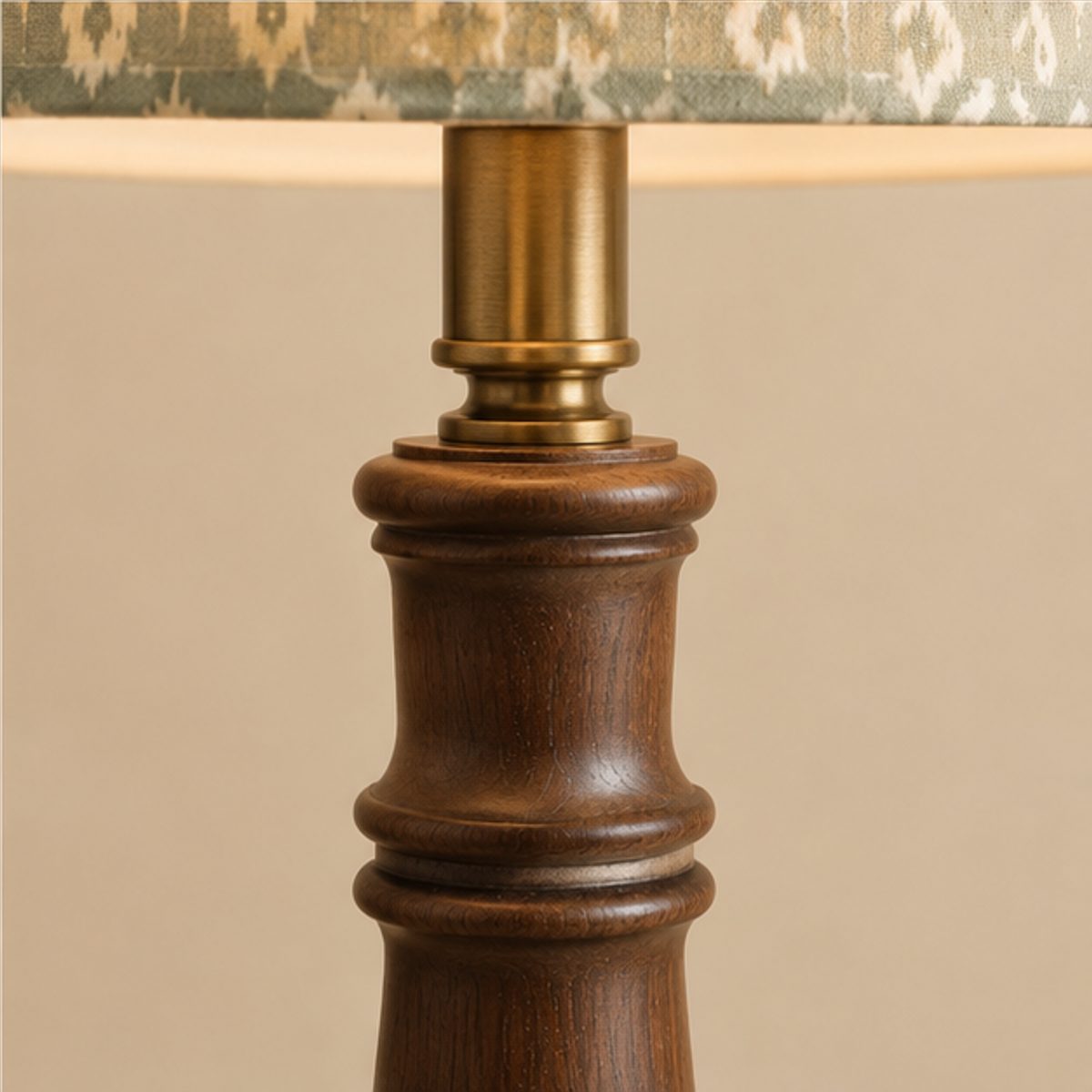 desk table lamp spec Close-up of the turned dark wood column and antique brass lamp holder of a table lamp